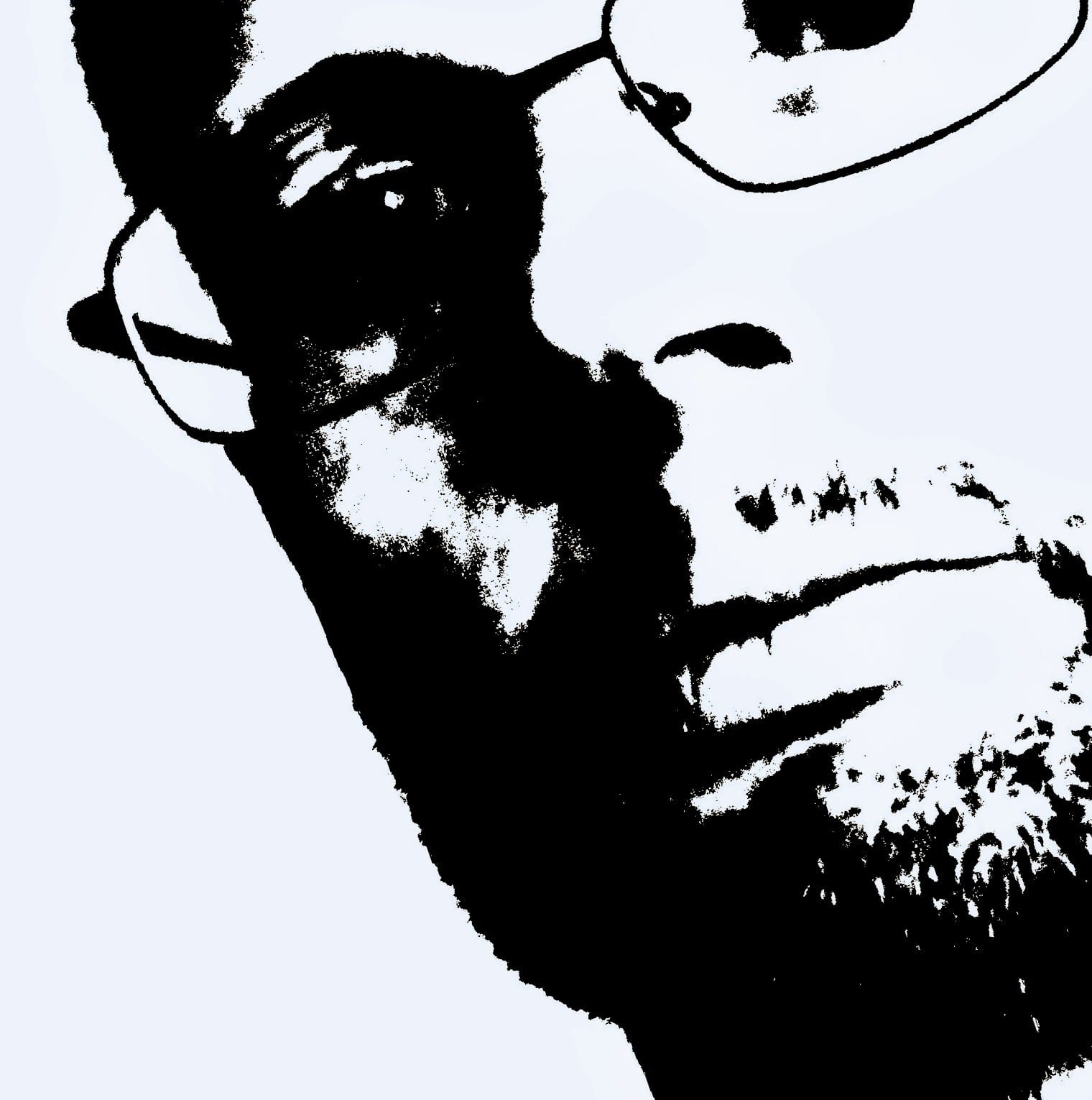 Professional headshot of Tommy Aliff